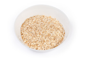 Uncooked rolled oats in bowl on a white background