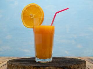 Fresh juice, mix fruits, orange drink on a blue background