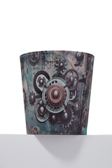 Close-up shot of a leather retro-inspired trash can. The cylindrical waste basket with a print is isolated on a white background. Front view.
