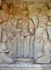 Indian rock art of bas relief sculptures of God, Animals carved in the monolithic rock cut cave temples in Mahabalipuram, Tamilnadu, India. Ancient historical relief sculptures in Tamilnadu.