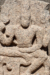 Indian rock art of bas relief sculptures of God, Animals carved in the monolithic rock cut cave temples in Mahabalipuram, Tamilnadu, India. Ancient historical relief sculptures in Tamilnadu.