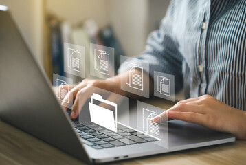 Document Management System (DMS) Woman working on a laptop with a virtual screen. Process automation to efficiently manage files. Software for archiving, searching, and managing corporate files.