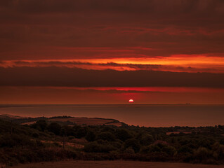 Dramatic sunrise over the south coast from the Fire Hills within Hastings Country Park East Sussex south east England UK
