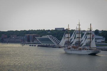 Luxury sailing clipper windjammer cruiseship cruise ship liner Sea Cloud Spirit sail away from port...