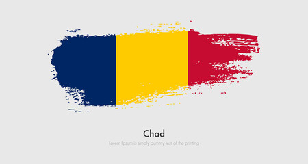 Obraz premium Brush painted grunge flag of Chad. Abstract dry brush flag on isolated background