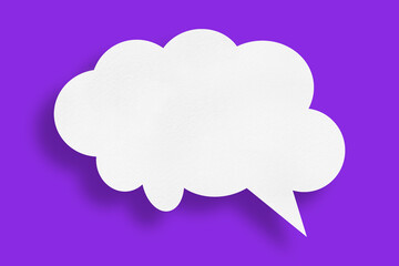 white cloud paper speech bubble shape against purple background