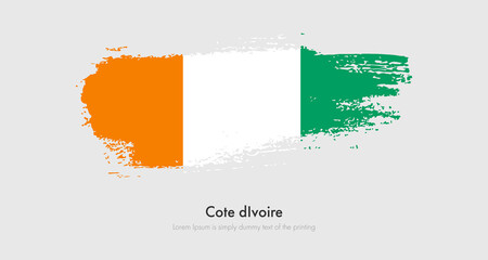Brush painted grunge flag of Cote dIvoire. Abstract dry brush flag on isolated background