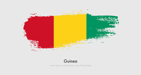 Obraz premium Brush painted grunge flag of Guinea. Abstract dry brush flag on isolated background