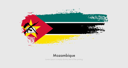 Brush painted grunge flag of Mozambique. Abstract dry brush flag on isolated background