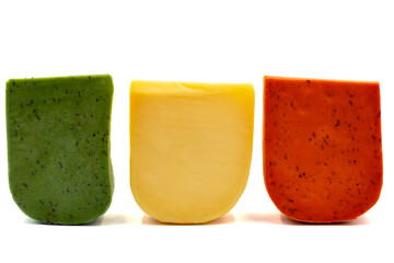 Hard Dutch gouda cheese. Assortment of guoda cheese isolated on a white background. close up