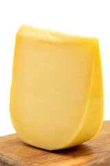 Yellow gouda cheese. Hard Dutch gouda cheese, isolated on white background. close up
