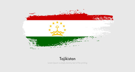 Brush painted grunge flag of Tajikistan. Abstract dry brush flag on isolated background