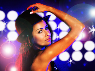 Disco party, light and woman in a club at night dancing alone on rave dance floor in lens flare...