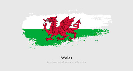 Brush painted grunge flag of Wales. Abstract dry brush flag on isolated background
