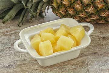 Marinated pineapple slices in the bowl