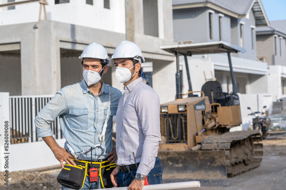 Leinwandbilder engineer discussing with architect about project in building construction site.