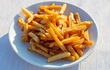 fried french fries on a white plate