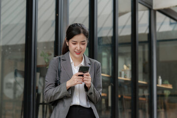 A businesswoman completes KYC using an online banking program in order to open a digital savings account. The definition of cyber security.