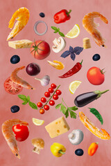 Flying food. Shrimps, vegetables, cheese and mushrooms on a pink background.
