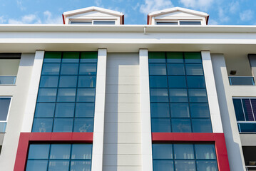 Low angle view of an apartment building with balconies.
