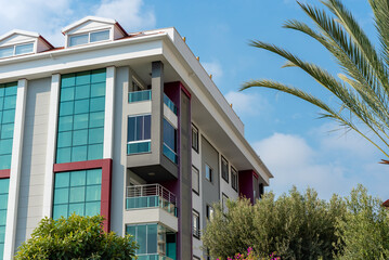 Low angle view of an apartment building with balconies.