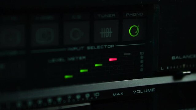 Increasing Volume on Amplifier, Phono Selection and Peak Level Meter, Close Up
