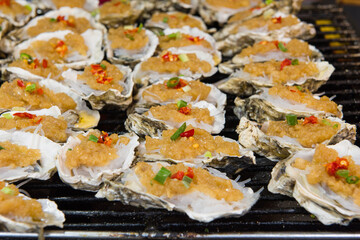 Traditional grilled seafood oysters on the grill