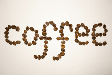 Coffee word made of coffee beans.