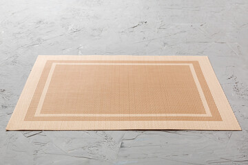 Perspective view of brown tablecloth for food on cement background. Empty space for your design
