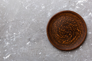 Top view of empty plate on cement background. Empty space for your design