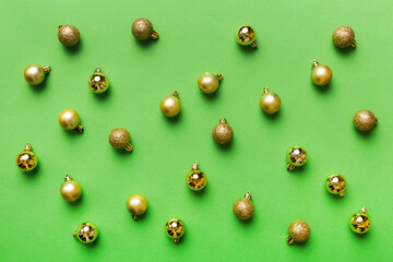 Christmas composition. a pattern of christmas balls on colored background. Flat lay, top view New year decor