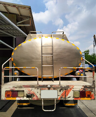 Behind view truck with stainless oil tank