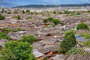 The traditional roofs of the old town of Lijiang, China. Dayan, commonly called the Old Town of Lijiang is the historical center of Lijiang City, in Yunnan, China. It is a UNESCO World Heritage Site