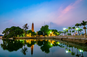 Fototapeta na wymiar Tran Quoc Pagoda, the oldest Buddhist temple in Hanoi, is located on a small island near the southeastern shore of Hanoi's West Lake, Vietnam.