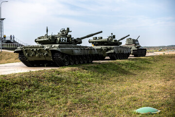 demonstration of modern military equipment in the field on a sunny summer day