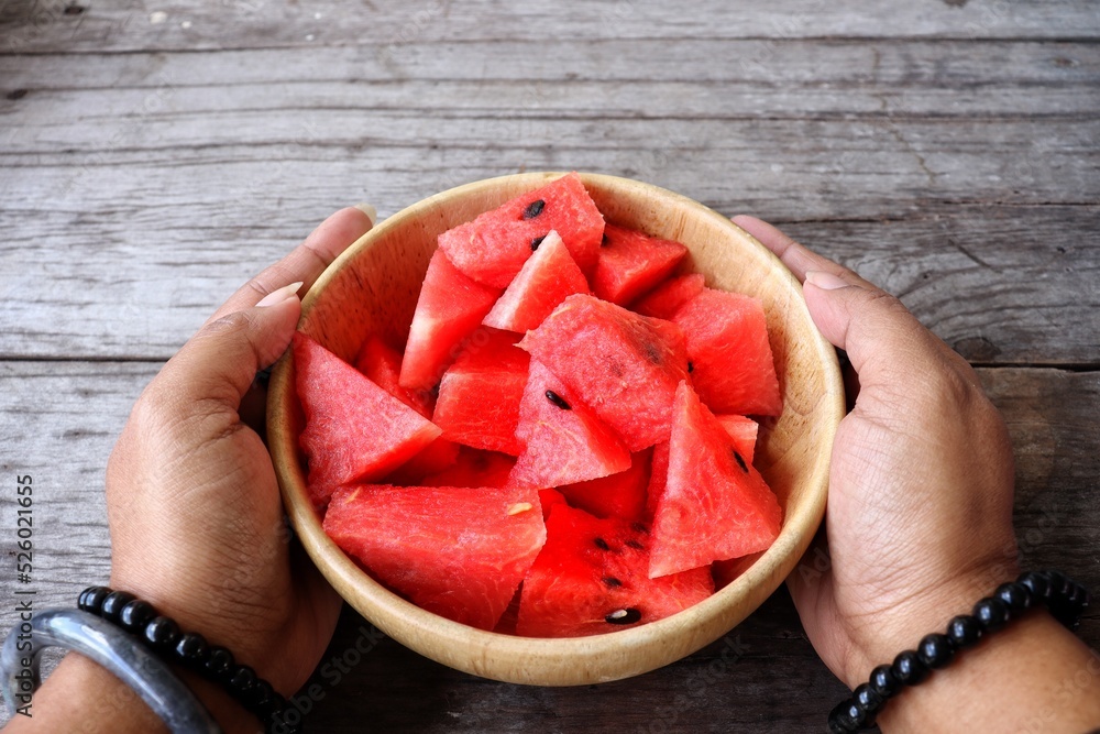 Wall mural watermelon summer fruit on wood background