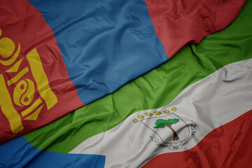waving colorful flag of equatorial guinea and national flag of mongolia.