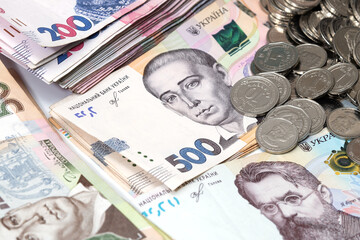 heap of different Ukrainian hryvnia in isolated background
