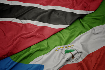 waving colorful flag of equatorial guinea and national flag of trinidad and tobago.