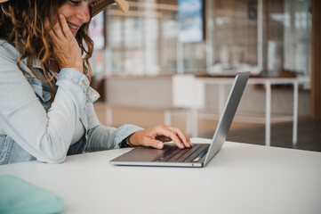 Glad woman browsing social media in airport