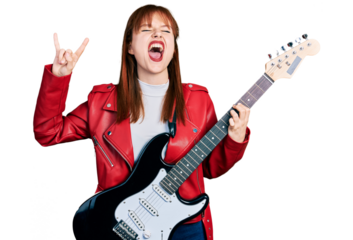Redhead young woman playing electric guitar doing rock gesture angry and mad screaming frustrated and furious, shouting with anger looking up.