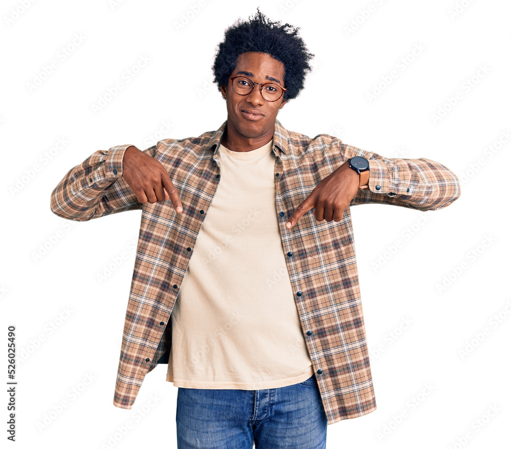 Poster handsome african american man with afro hair wearing casual clothes and glasses pointing down lookin