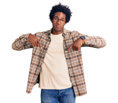 Handsome african american man with afro hair wearing casual clothes and glasses pointing down looking sad and upset, indicating direction with fingers, unhappy and depressed.