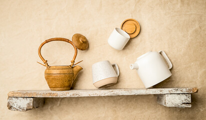 ceramic teapot and cup on a shelf, copy space for promo or ad, banner