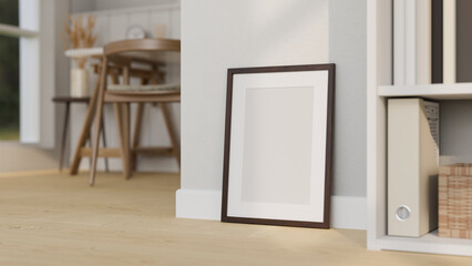 Frame poster mockup on minimal wooden floor over the white wall in minimal Scandinavian living room