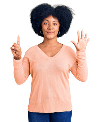 Young african american girl wearing casual clothes showing and pointing up with fingers number six while smiling confident and happy.