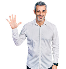 Middle age hispanic with grey hair wearing casual white shirt showing and pointing up with fingers...