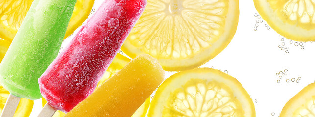 Bright popsicle sticks on Slices of lemon in soda water background
