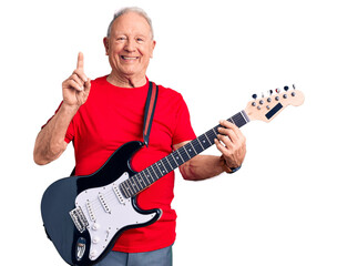 Senior handsome grey-haired man playing electric guitar surprised with an idea or question pointing finger with happy face, number one