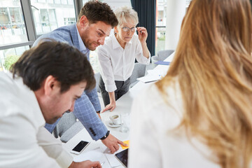 Fototapeta premium Group of business people brainstorming in the office